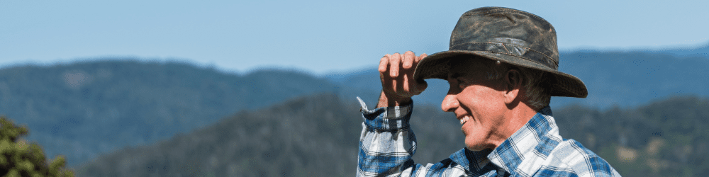 Happy farmer tipping hat